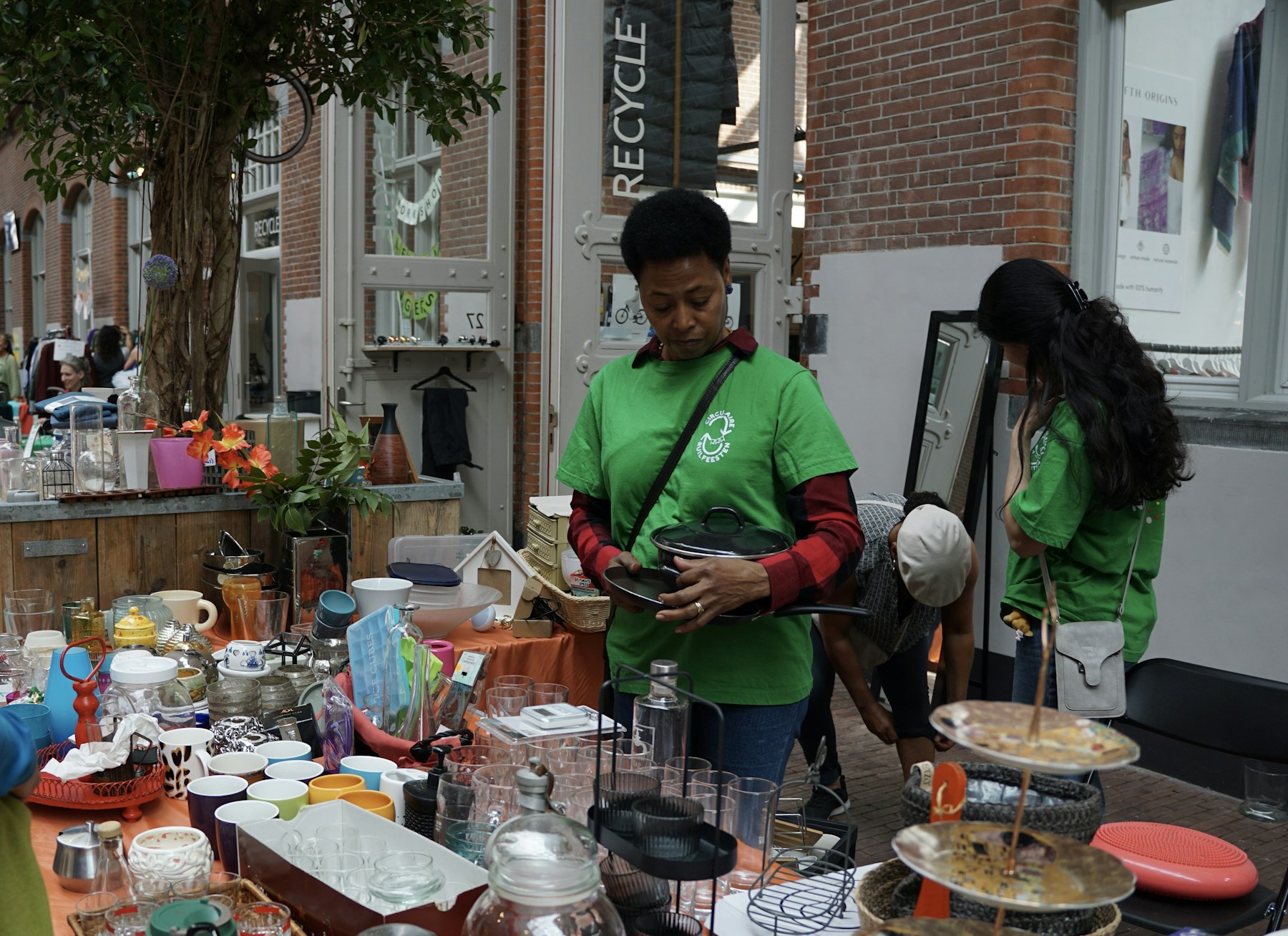 Assorted secondhand items displayed for sale in a local marketplace